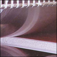 Same board as opposite page comes out of the nip rollers.