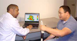Subject uses Tactilus® Sensor System to demonstrate the pressure needed to squeeze a toothpaste tube