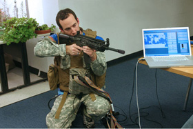 Soldier and rifle with vest and body armor being tested by sensor software