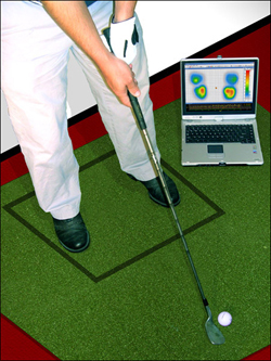 The Tactilus sensor pad, which is underneath the green mat, instantly transmits data to the Tactilus body mapping software visible on the laptop screen. The sensor pad is like an "electronic skin" which operates by the principles of piezoresistance.