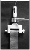 Figure B-4: An Omega LCFA-10K load cell was placed in series within the quadriceps tendon. A custom designed and built coupler interfaced the load cell with nylon webbing. The nylon webbing was wrapped around a quick release bolt allowing easy assembly and disassembly.