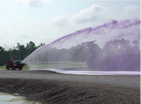 Figure 4.5.4: 300 gpm combined agent Williams Hydro-ChemTM bumper turret nozzle being used to conduct a combined agent throw test. figure 4.5.4