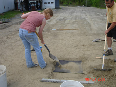 Placement of sifted sand over pressure pad, 27 May 2008. Figure C2. Placement of sifted sand over pressure pad, 27 May 2008.