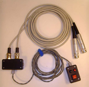 Biomechanics Figure 9 Custom switch unit built to operate two fluoroscopes simultaneously with a single input from the operator. Red and black buttons toggle high and low radiation dosage, respectively.