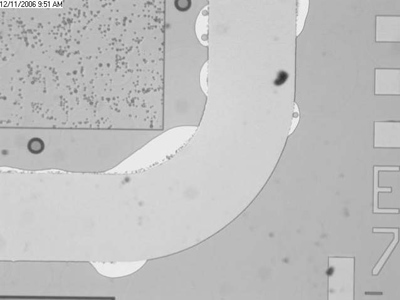 Fig. 5: Example of solder spilled outside of seed metal area after bonding. wafer bonding
