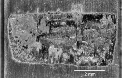Fig. 14. Fretting scar from specimen 05-953 showing wear damage due to gross slip after 2 million cycles.