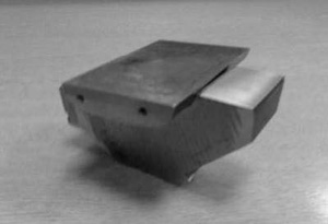 Fig. 6 Photographs of (a) the wheel and rail specimens and (b) the loading frame showing the location of the ultrasonic transducer.